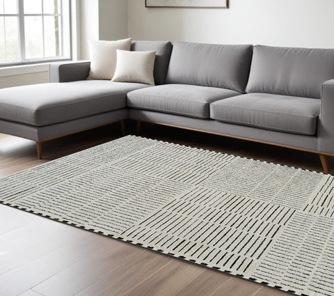 7' X 10' Cream and Black Abstract Distressed Area Rug