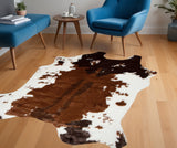 4' X 5' Brown And White Cowhide Print Hand Knotted Area Rug