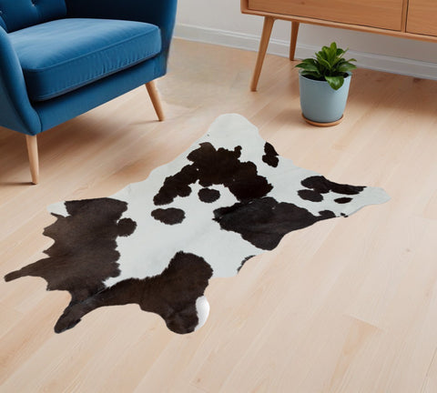 2' X 3' Brown And White Cowhide Abstract Hand Woven Area Rug