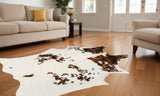 6' X 7' Brown And White Cowhide Cowhide Print Area Rug