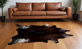 5' X 7' Brown And White Cowhide Cowhide Print Area Rug