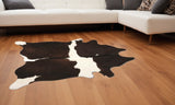 5' X 7' Brown And White Cowhide Cowhide Print Area Rug