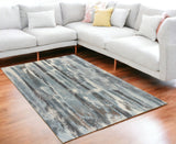 5' X 8' Teal Blue And White Abstract Area Rug