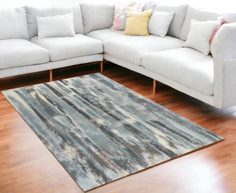 5' X 8' Teal Blue And White Abstract Area Rug