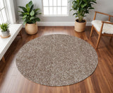 6' Beige And Brown Abstract Hand Woven Round Rug