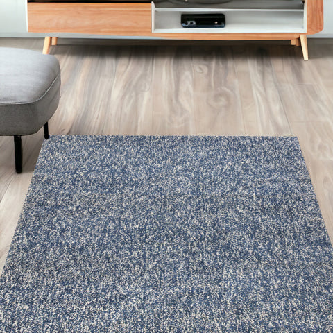 5' X 7' Indigo And Ivory Abstract Hand Woven Area Rug