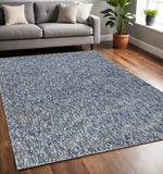 5' X 7' Indigo And Ivory Abstract Hand Woven Area Rug