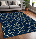5' X 7' Navy Blue And Ivory Geometric Hand Hooked Area Rug