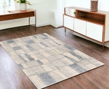 4' X 6' Ivory And Blue Abstract Geometric Distressed Area Rug