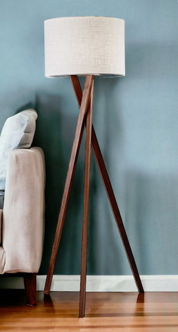 63" Brown And White Solid Wood Tripod Floor Lamp With White Linen Drum Shade