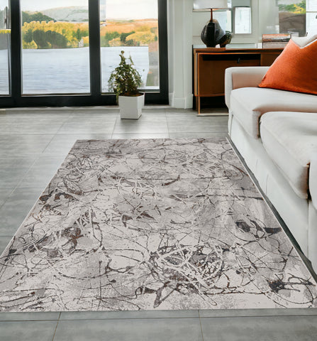 5' X 8' Ivory Gray And Brown Abstract Area Rug