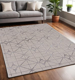 5' X 8' Ivory And Brown Geometric Area Rug