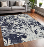 5' X 7' Blue And Ivory Abstract Area Rug