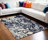7' X 10' Blue And Ivory Abstract Area Rug
