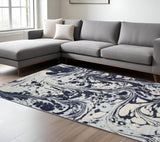 7' X 10' Blue And Ivory Abstract Area Rug