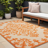 8' X 11' Orange And Ivory Damask Indoor Outdoor Area Rug