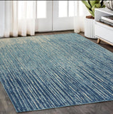 5' X 7' Blue And Ivory Abstract Area Rug