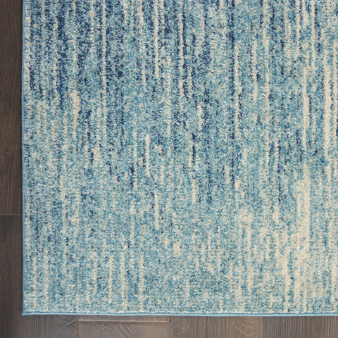 7' X 10' Blue And Ivory Abstract Area Rug