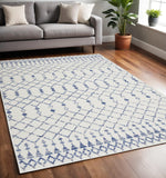 5' X 7' Ivory And Blue Geometric Area Rug