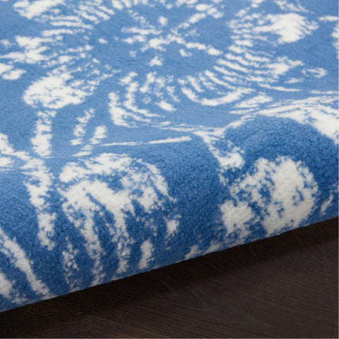 6' X 9' Blue And Ivory Floral Distressed Area Rug
