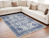 5' X 7' Ivory And Blue Geometric Distressed Area Rug