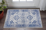 6' X 9' Ivory And Blue Geometric Distressed Area Rug