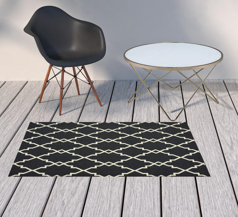2' X 4' Black And Ivory Indoor Outdoor Area Rug