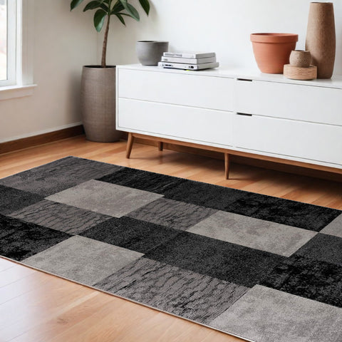 6' X 9' Black And Gray Geometric Distressed Area Rug