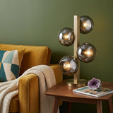 24" Brass Metal Four Light Novelty Table Lamp With Silver Metallic Globe Shades