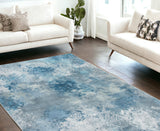 6' X 9' Blue And Ivory Abstract Area Rug