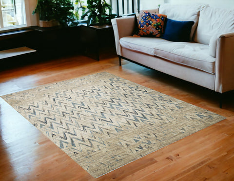 5' X 8' Ivory And Blue Chevron Area Rug