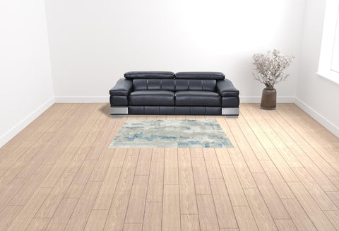 5' X 8' Ivory Gray And Blue Abstract Power Loom Stain Resistant Area Rug