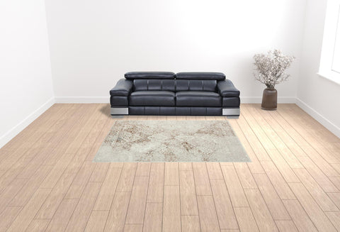 7' X 9' Beige Cream And Brown Damask Stain Resistant Area Rug