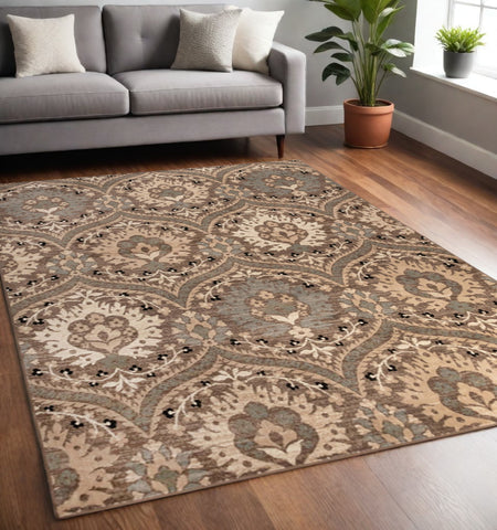 5' X 8' Beige And Ivory Floral Area Rug