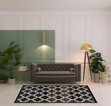 5' X 8' Black Brown And Ivory Geometric Area Rug