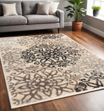 5' X 8' Beige Black And Brown Floral Medallion Area Rug