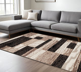 7' X 9' Black Brown And Beige Patchwork Area Rug