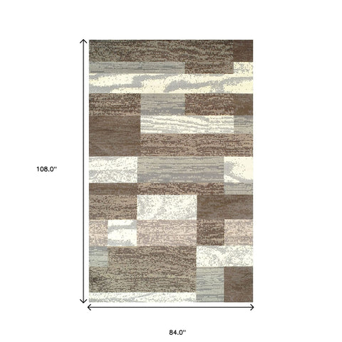 7' X 9' Blue And Ivory Patchwork Area Rug