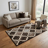 5' X 8' Brown Black And Ivory Quatrefoil Distressed Area Rug