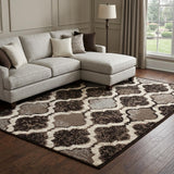 6' X 9' Brown Black And Ivory Quatrefoil Distressed Area Rug
