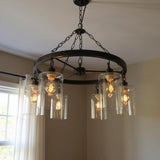 Black Shaded Six Light Metal and Transparent Glass Chandelier With Clear Shades