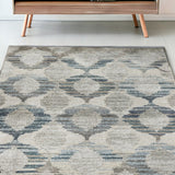 5' X 8' Blue and Ivory Geometric Area Rug
