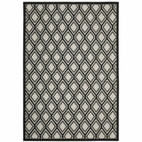 7' X 9' Beige and Black Geometric Stain Resistant Indoor Outdoor Area Rug