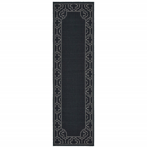 2' X 8' Black and Ivory Stain Resistant Indoor Outdoor Area Rug