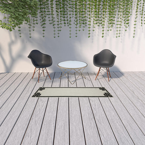 2' X 7' Beige and Black Stain Resistant Indoor Outdoor Area Rug