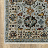 5' X 8' Blue Beige Grey Green Yellow And Rust Oriental Power Loom Stain Resistant Area Rug With Fringe