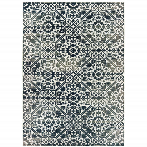 5' X 8' Navy And Ivory Geometric Power Loom Stain Resistant Area Rug