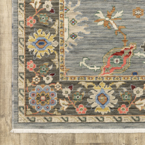 6' X 9' Blue Grey Gold Green Pink Orange Ivory And Red Oriental Power Loom Stain Resistant Area Rug With Fringe