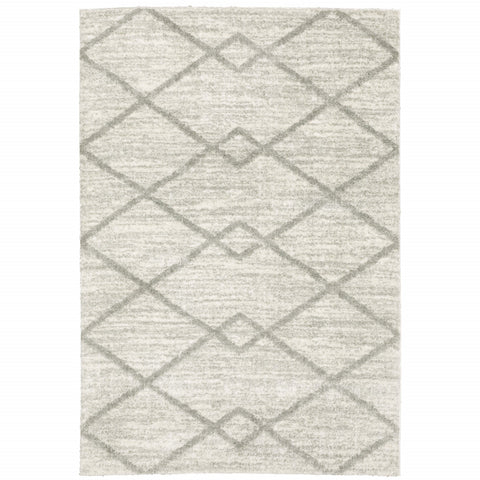5' X 8' Ivory And Grey Geometric Shag Power Loom Stain Resistant Area Rug