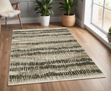 4' X 6' Beige Ivory Charcoal Brown Tan And Grey Abstract Power Loom Stain Resistant Area Rug With Fringe
